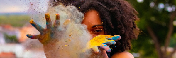 Woman throwing colourful powder